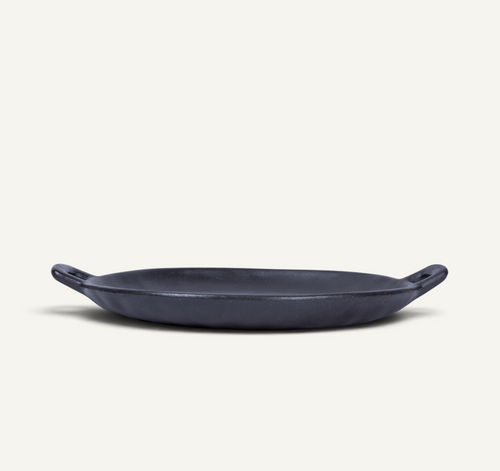 A Japanese style ceramic platter with side handles, photographed on a clean off-white background.