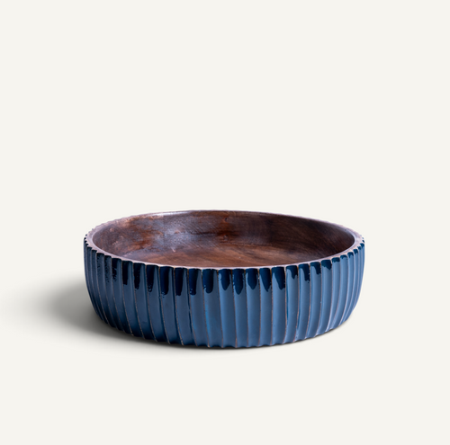 A round acacia bowl with a fluted exterior and a dark brown glazed interior, shown on a light beige background.