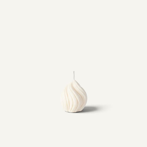 A small helix-shaped candle in a light gray-blue color with a ribbed texture and a single wick, centered against a solid off-white background.